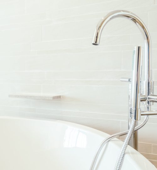 Beautiful luxury White bathtub and faucet sink decoration in bathroom interior - Vintage Light Filter